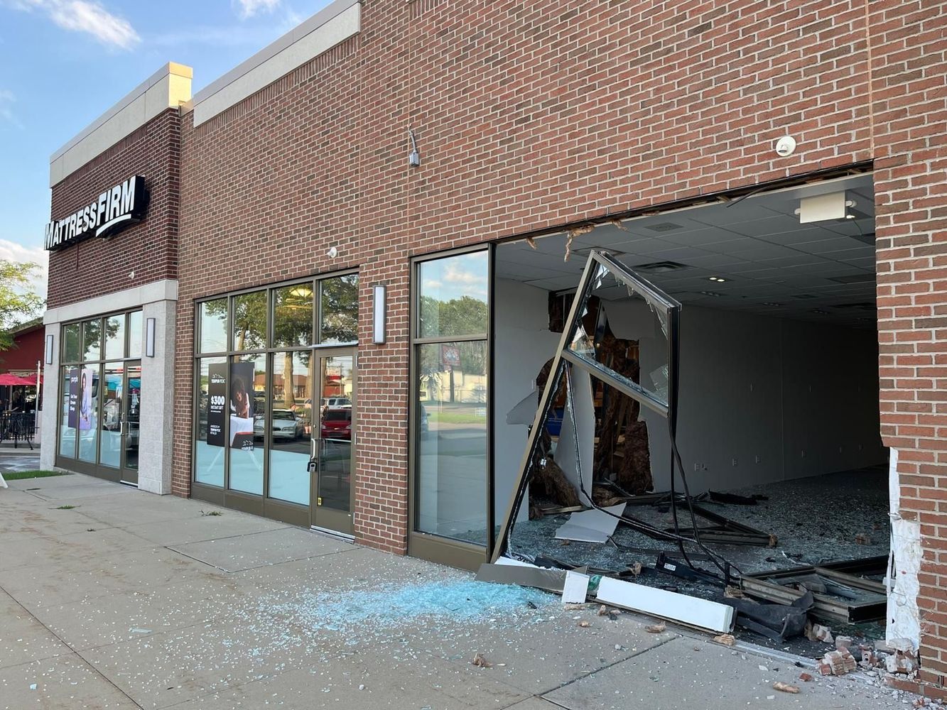 Shattered commercial storefront window requiring repair